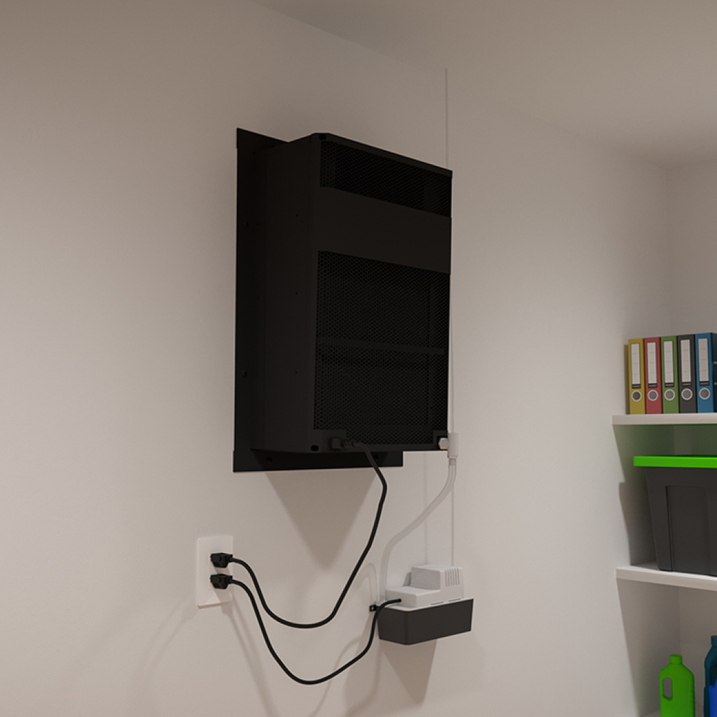 A black WhisperKOOL Extreme 8000ti cooling unit is mounted on a white wall with cables plugged in below. Shelves with folders and containers are visible on the right, suggesting this area may also serve as a wine cellar cooling space.