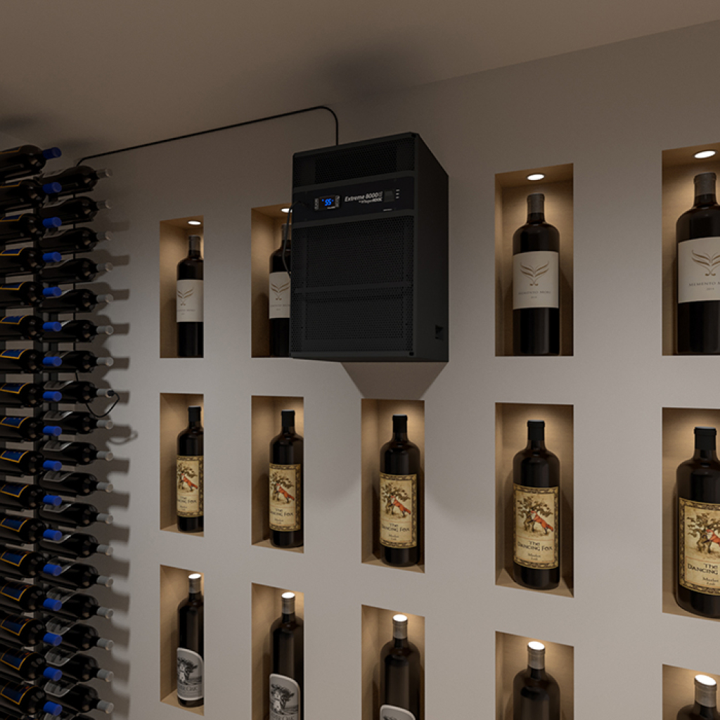 A wine cellar wall features backlit cubbyholes displaying bottles, with the WhisperKOOL Extreme 8000ti wine cellar cooling unit mounted above.