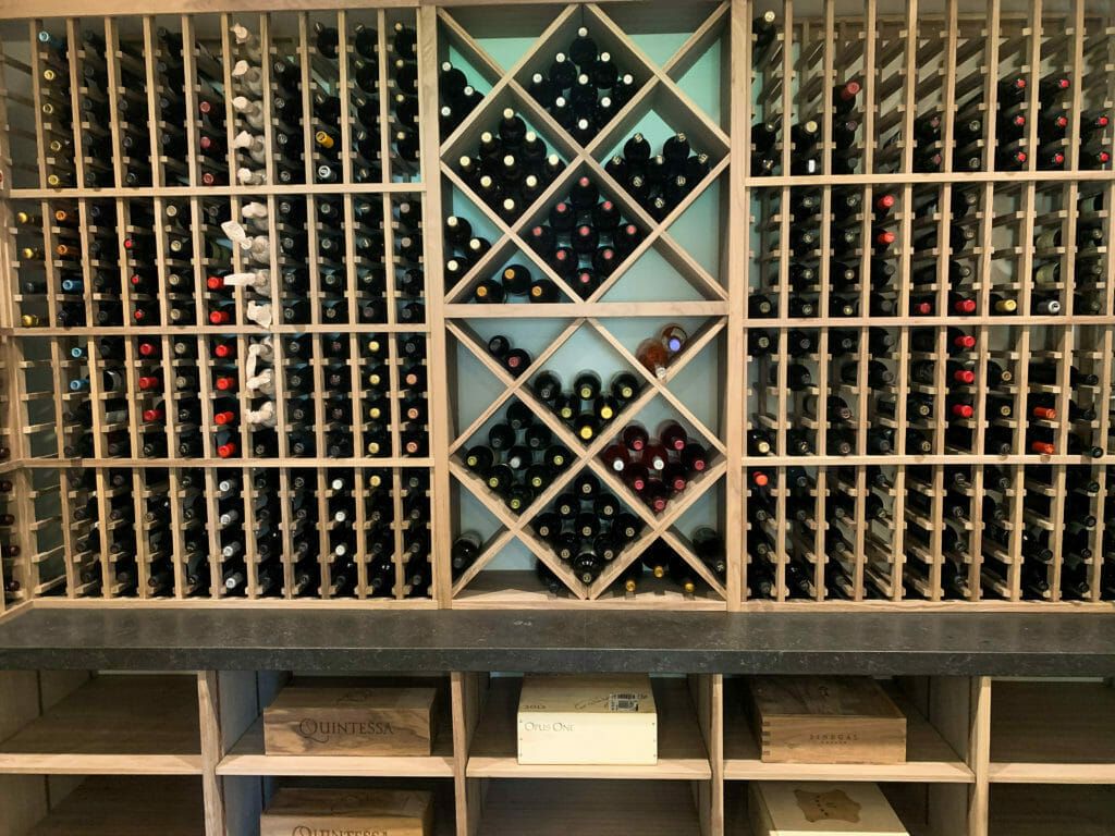 Wine rack, bottles of wine.