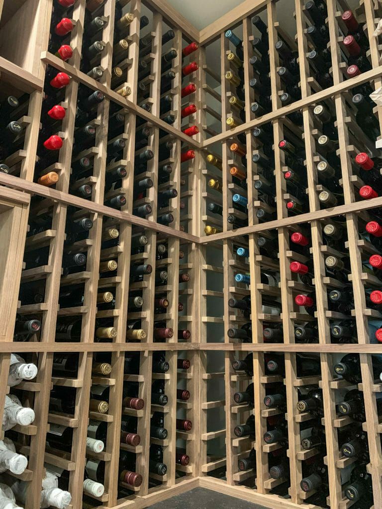 A collection of wine bottles in a cellar.