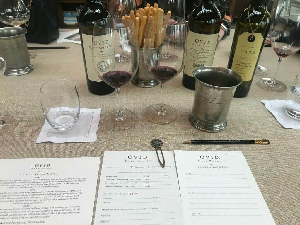 Table, wine bottles.