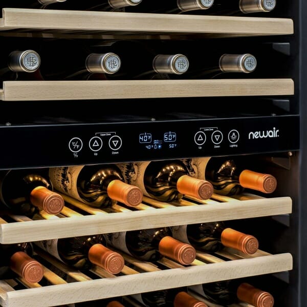 A spacious wine fridge with a capacity of 160 bottles, featuring dual zones and a built-in compressor - the NewAir 27".
