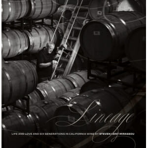 A photo of a man in front of Lineage: Life and Love and Six Generations in California Wine barrels.