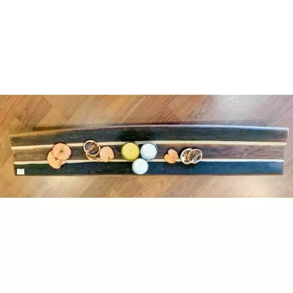 A Cheese/Charcuterie board made from wine staves, adorned with oranges and lemons.
