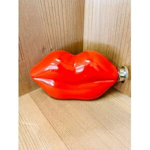 A Lips Flask on a table.