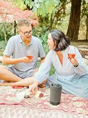 Two people drinking from a dishwasher-safe, BPA-free and 100% Tritan wine glasses pack that is shatterproof and suitable for boating.