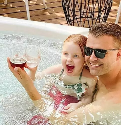 A man and a little girl using Elegant & Practical Tritan Wine Glasses | Reusable, Dishwasher-Safe | BPA-Free | 100% Tritan | 4-Pack during their hot tub