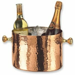 Old Dutch Copper Wine/Champagne Cooler with two bottles of wine.