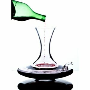 A bottle of Wine Science Decanter is being poured into a decanter.