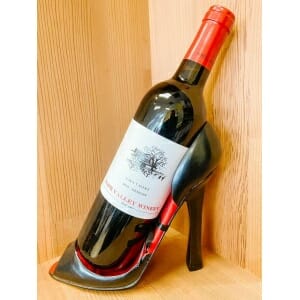 A stylish wine holder shaped like a stiletto shoe.