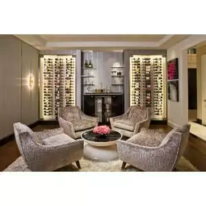 ws31_example.jpg A living room with chairs and a W Series 3′ Wall Mounted Metal Wine Rack for 9 bottles.
