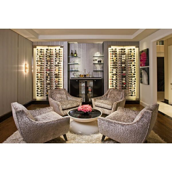 A living room with chairs and a W Series 3′ Wall Mounted Metal Wine Rack for 9 bottles.