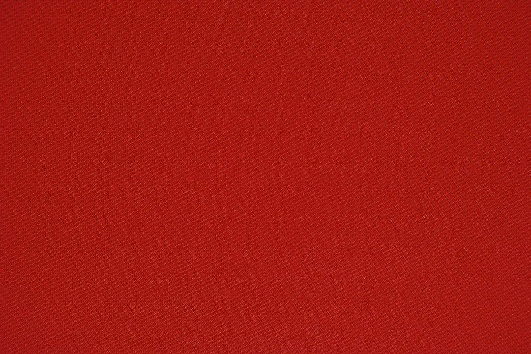 A close up image of a red fabric.