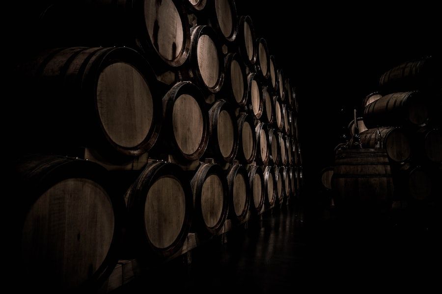 Wine barrels in a dark room.