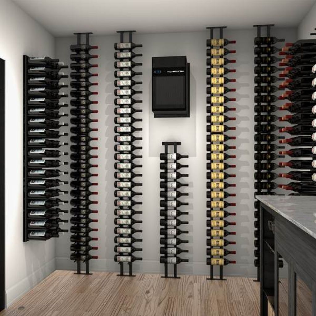 A modern wine cellar with multiple vertical racks holding wine bottles. The room features a light wooden floor and a small countertop on the right.