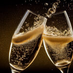 Two champagne glasses clink together, causing bubbles and liquid to splash, set against a dark background—perfect for celebrating with Champagne bottles from exclusive Napa collections.